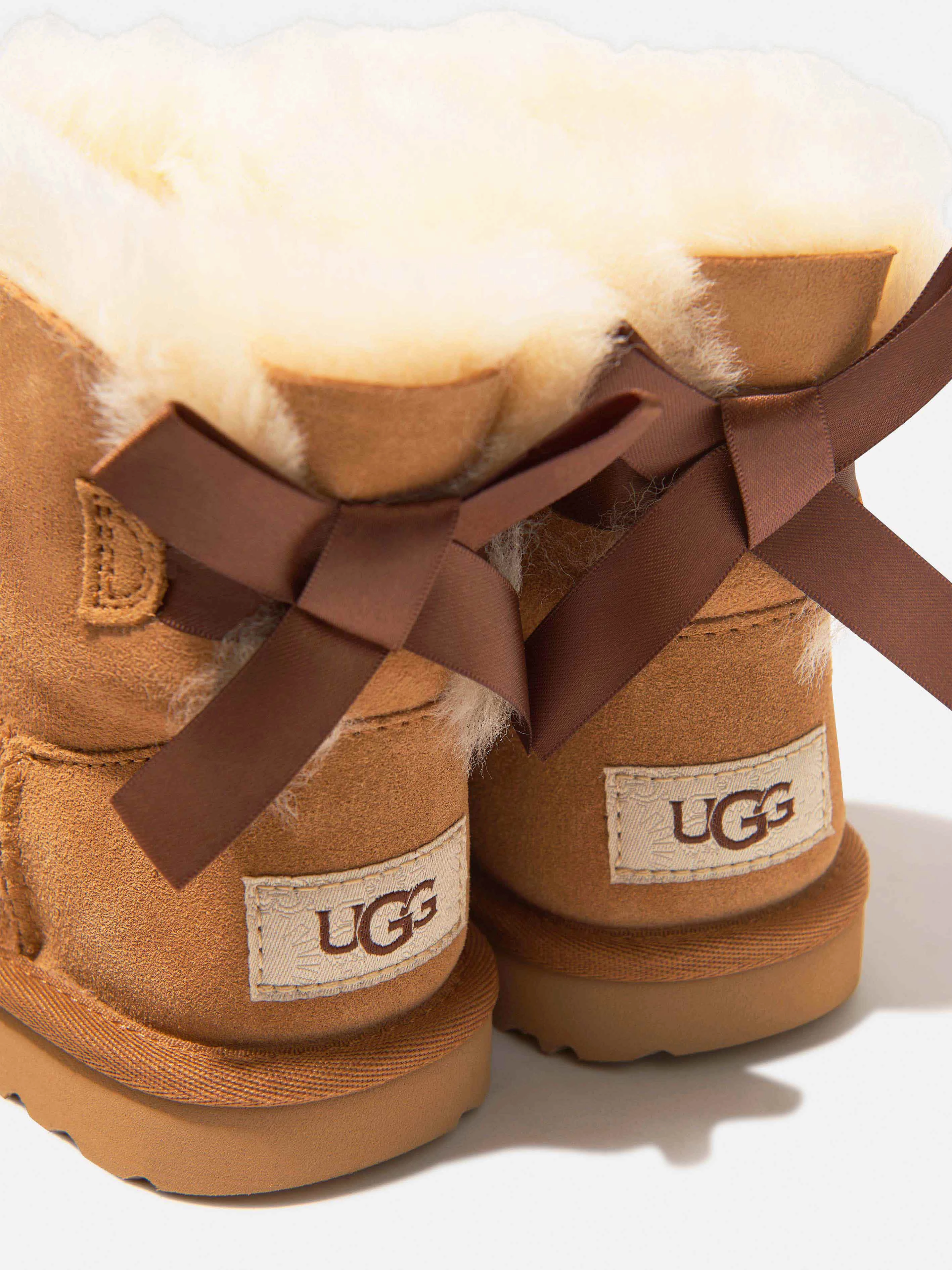 Be Unique, Shop Unique UGG Girls Mini Bailey Bow II Boots in Brown Fits Any Lifestyle