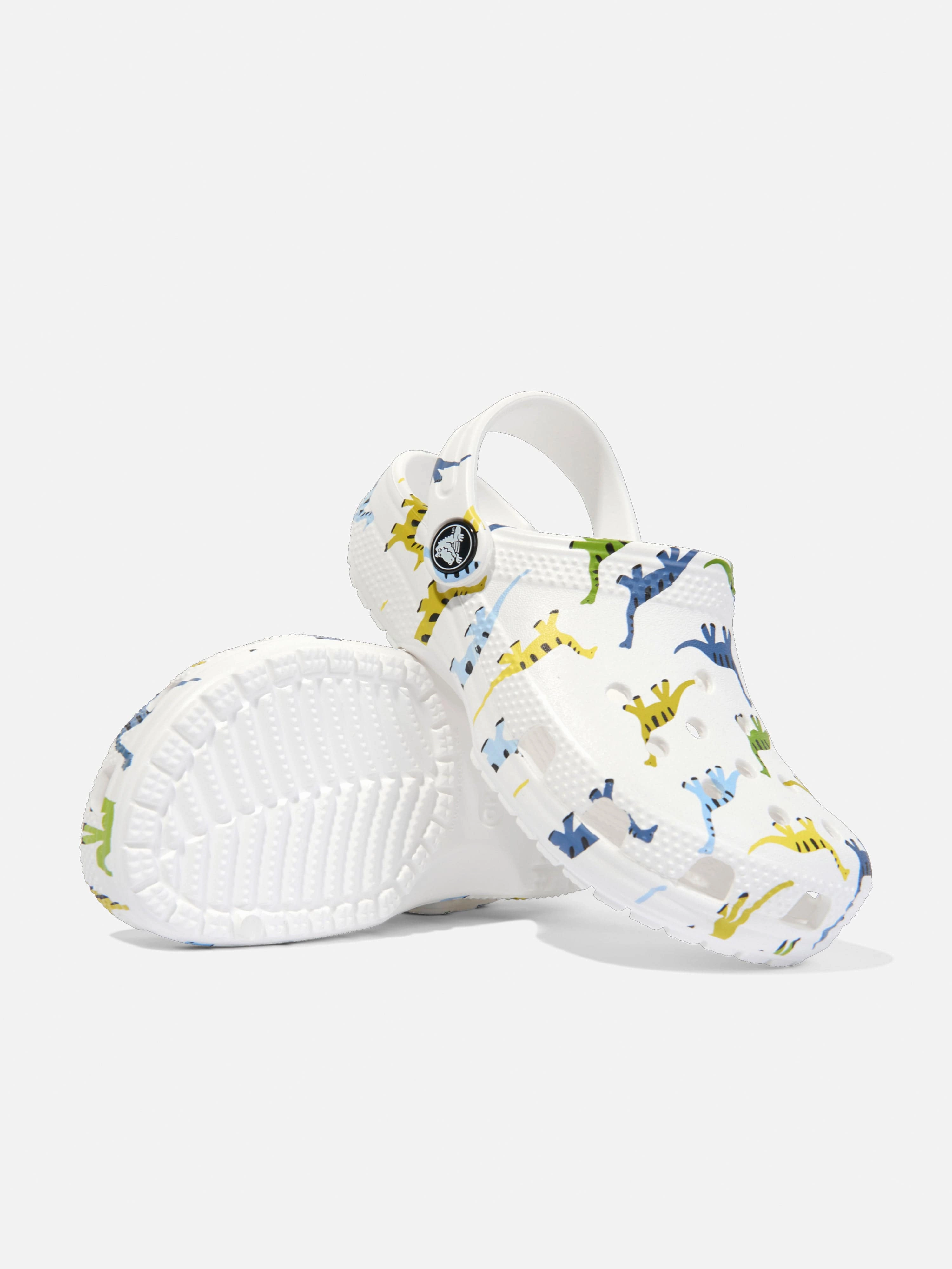 Treat Yourself Today Crocs Boys Classic Character Dino Print Clog in White Discover More